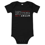 Tesla inspired apparel. Elon Musk quote. Against All Odds image centered on black onesie.