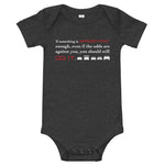 Tesla inspired apparel. Elon Musk quote. Against All Odds image centered on gray onesie.