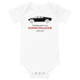 Tesla inspired apparel. Cybertruck. Apocalypse Near You image centered on baby onesie.