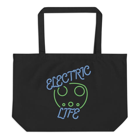 Tesla inspired apparel. EV car charger. Electric Life image centered on large tote bag.