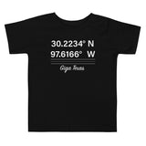 Tesla inspired apparel. Texas Gigafactory GPS coordinates. Birthplace Texas image centered on toddler t-shirt.