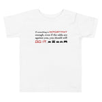 Tesla inspired apparel. Elon Musk quote. Against All Odds image centered on kids white t-shirt.