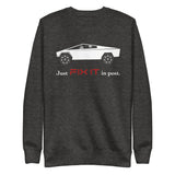 Tesla inspired apparel. Elon Musk quote. Cybertruck. Just Fix It In Post image centered on pullover sweatshirt.